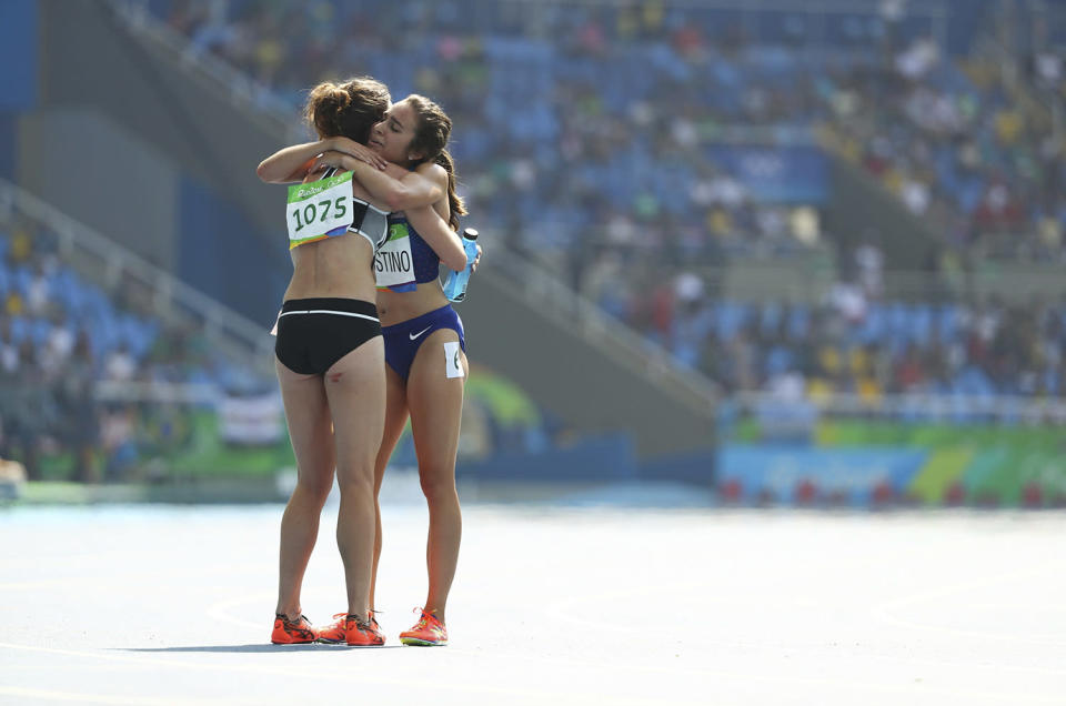 <p>Nikki Hamblin of New Zealand and Abbey D’Agostino of USA embrace after the women’s 5000m round 1 race at the Rio Olympics. (REUTERS/Lucy Nicholson) </p>