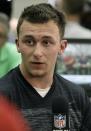 Texas A&M quarterback Johnny Manziel talks to members of the media during pro day for NFL football representatives in College Station, Texas, Thursday, March 27, 2014. (AP Photo/Patric Schneider)