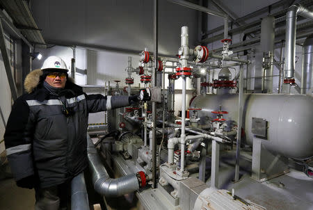 An employee works at a natural and associated petroleum gas processing plant in the Yarakta Oil Field, owned by Irkutsk Oil Company (INK), in Irkutsk Region, Russia March 11, 2019. REUTERS/Vasily Fedosenko