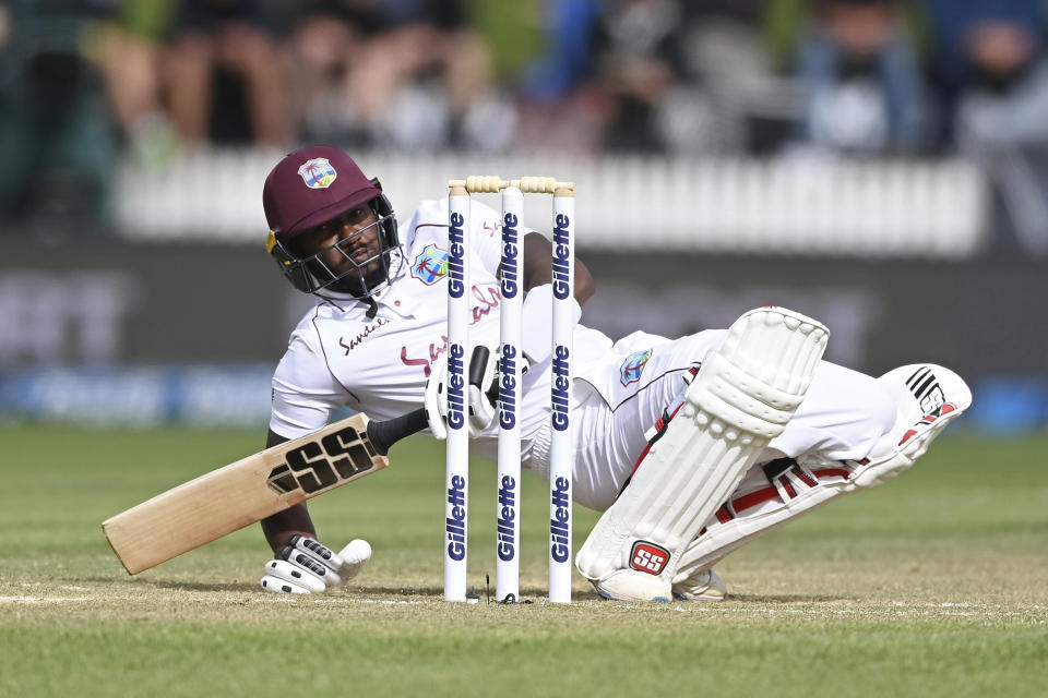 West Indies's Jermaine Blackwood falls to the ground while batting against New Zealand during play on day three of their first cricket test in Hamilton, New Zealand, Saturday, Dec. 5, 2020. (Andrew Cornaga/Photosport via AP)