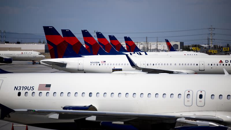 Delta Air Lines jets are parked at their gates at the Salt Lake City International Airport in Salt Lake City on Friday, July 1, 2022.