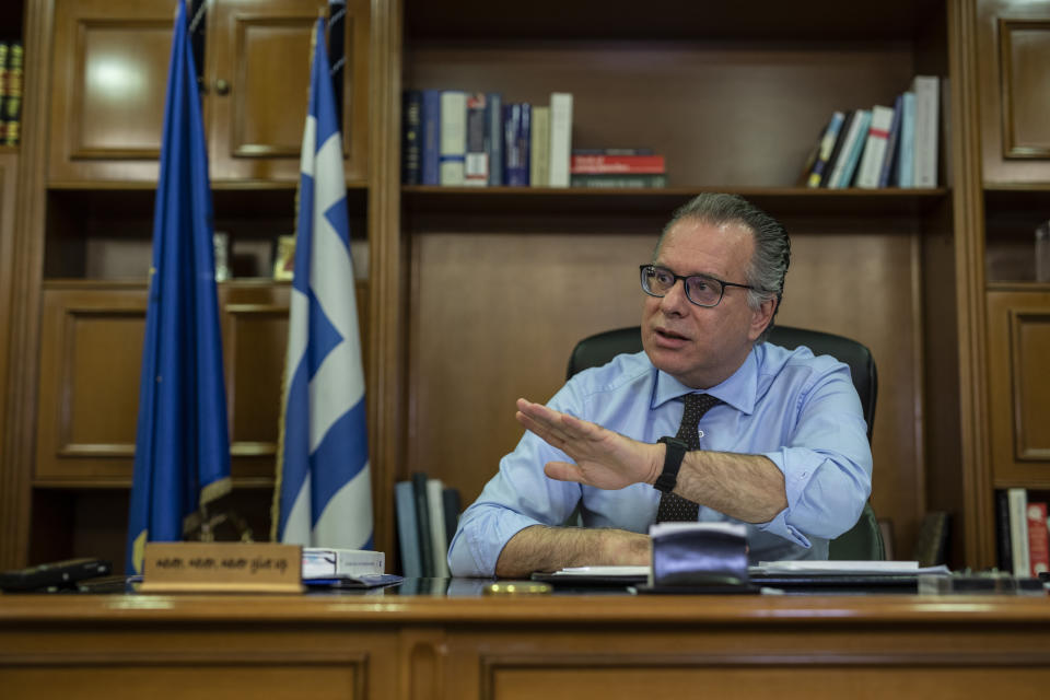 Alternate Minister for immigration policy in the ministry of Citizen's Protection of Greece, George Koumoutsakos speaks to the Associated Press during an interview , in Athens, on Friday, Sept. 27, 2019. Authorities in Greece say seven people have died Friday after a boat carrying migrants sank in the eastern Aegean Sea. (AP Photo/Petros Giannakouris)