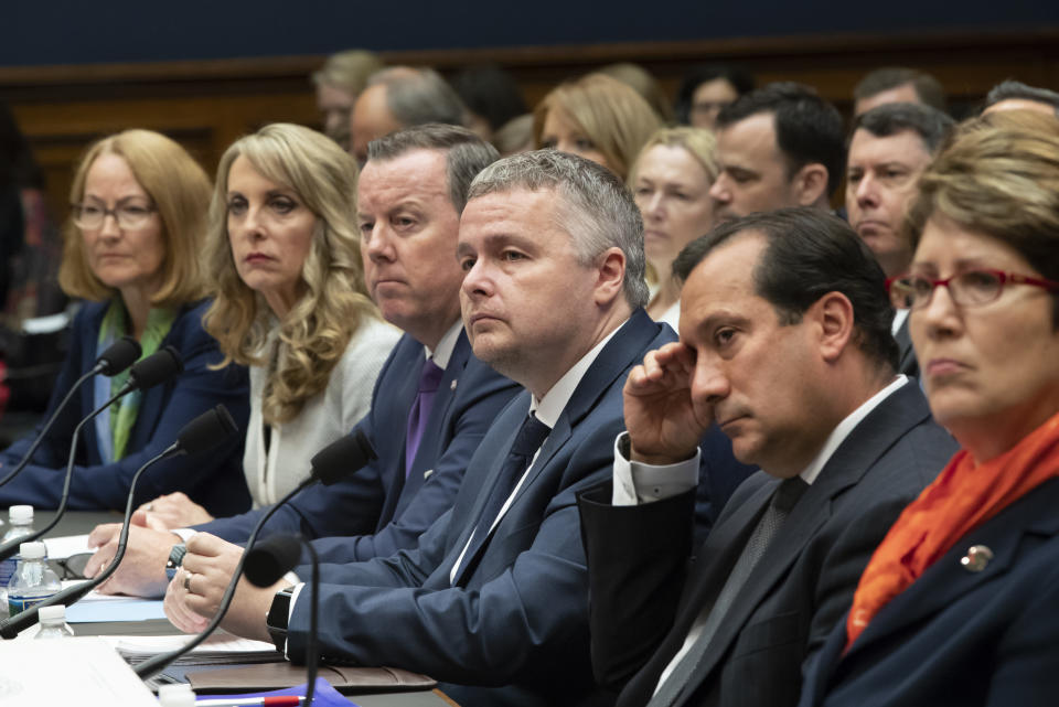 FILE - Witnesses prepare to testify before the House Commerce Oversight and Investigations Subcommittee about the Olympic community's ability to protect athletes from sexual abuse, on Capitol Hill in Washington, Wednesday, May 23, 2018. From left are: U.S. Olympic Committee Acting CEO Susanne Lyons, USA Gymnastics President and CEO Kerry Perry, USA Swimming President and CEO Tim Hinchey, USA Taekwondo Executive Director Steve McNally, USA Volleyball CEO Jamie Davis, and U.S. Center for SafeSport President and CEO Shellie Pfohl. A 2021 survey by the global advocacy group, World Players, found 13% of 297 athletes surveyed across the globe had reported experiencing sexual abuse at least once as a child in sports. (AP Photo/J. Scott Applewhite, File)