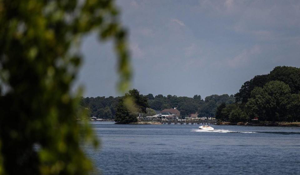 A boat drives by on Lake Norman in Huntersville, N.C., on Friday, August 18, 2023.
