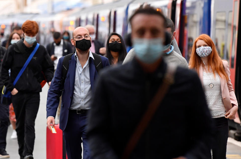 People wearing protective face masks are seen arriving at Waterloo station, the busiest train station in the UK, during the morning rush hour, amid the coronavirus disease (COVID-19) outbreak, in London, Britain, September 7, 2020. REUTERS/Toby Melville