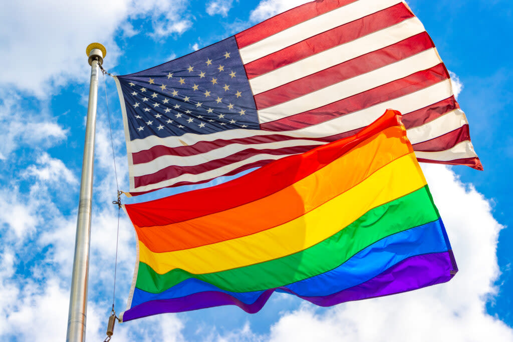 the rainbow pride flag and an American flag.