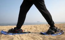 Special Olympics athlete Esraa Gamal trains with snowshoes on a beach in Alexandria, Egypt, July 18, 2017. REUTERS/Mohamed Abd El Ghany