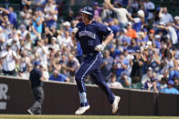 Chicago Cubs' Frank Schwindel rounds the bases after hitting a solo home run during the fourth inning of a baseball game against the San Francisco Giants in Chicago, Friday, Sept. 10, 2021. (AP Photo/Nam Y. Huh)