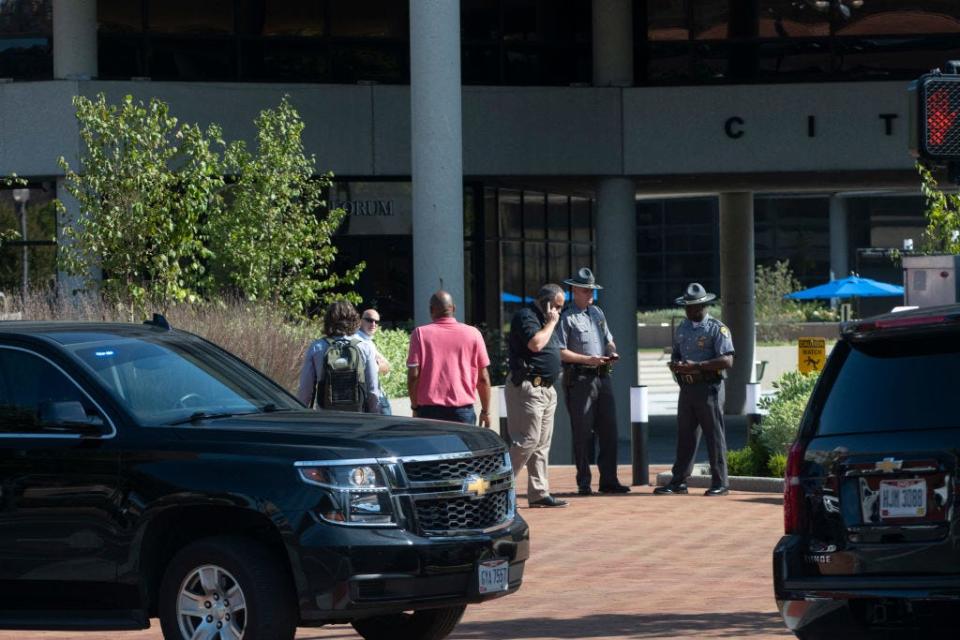 Police officers stand outside Springfield City Hall after bomb threats were called in on September 12, 2024.