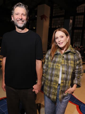 <p>Victor Boyko/Getty</p> Bart Freundlich and Julianne Moore attend the Bottega Veneta fashion show during the Milan Fashion Week on September 23, 2023.