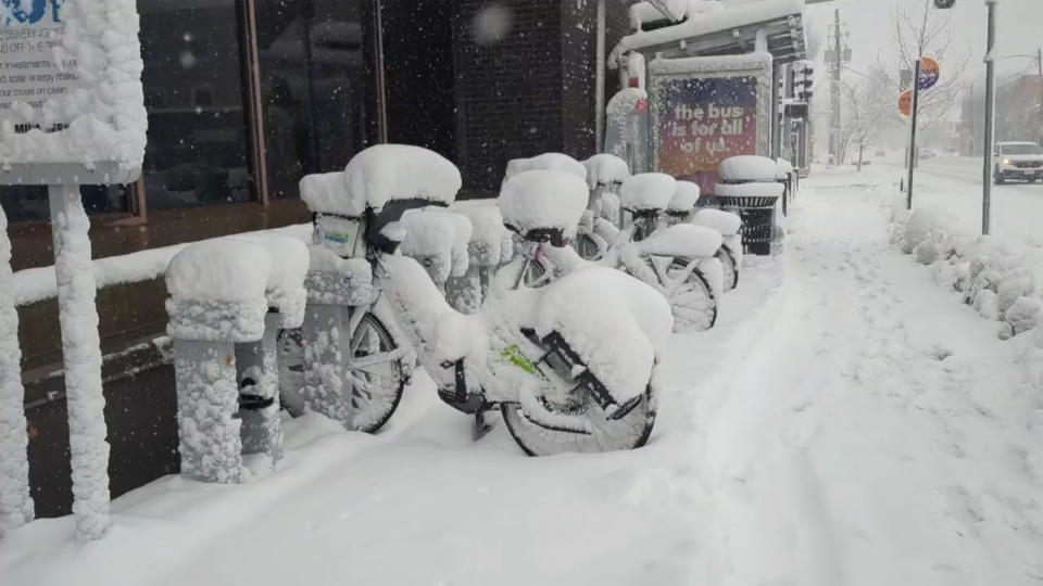 Snow covers bicycles during a snowstorm in Des Moines Iowa on Tuesday, Jan. 9, 2024. In the Midwest, where a snowstorm started Monday, up to 12 inches (30 centimeters) of snow could blanket a broad area stretching from southeastern Colorado all the way to the Upper Peninsula of Michigan, including western Kansas, eastern Nebraska, large parts of Iowa, northern Missouri and northwestern Illinois, said Bob Oravec, a forecaster with the National Weather Service in College Park, Md. (AP Photo/Nathan Ellgren)