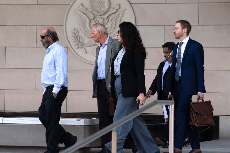 Defendant Jerry Boylan, captain of the Conception, left, followed by his defense team leaves federal court in Los Angeles, Thursday, May 2, 2024. A federal judge on Thursday sentenced Boylan to four years in prison and three years supervised release for criminal negligence after 34 people died in a fire aboard the vessel. (AP Photo/Richard Vogel)