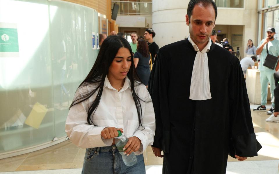 The wife of Mohamed Haouas, accompanied by her lawyer Florian Medico, leaves the courtroom during a break, in Montpellier on May 30, 2023 - Getty Images/Pascal Guyot