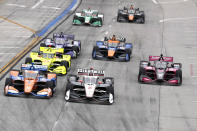 IndyCars begin the Grand Prix of Long Beach auto race into Turn 1 with Josef Newgarden (2) at the pole Sunday, Sept. 26, 2021, in Long Beach, Calif. (AP Photo/Alex Gallardo)