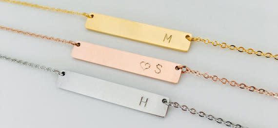 These initial necklaces, perfect for birthdays, holidays, or bridesmaids gifts, are one of hundreds of items on sale at Etsy this Labor Day. <a href="https://www.etsy.com/listing/294056891/bridesmaids-rose-gold-bar-gold-bar?ref=deals_center" target="_blank">Shop them here</a>.&nbsp; (Photo: <a href="https://www.etsy.com/listing/294056891/bridesmaids-rose-gold-bar-gold-bar?ref=deals_center" target="_blank">Etsy</a>)