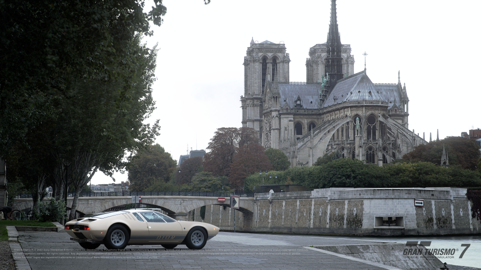 The Dior-customized vintage car in front of the Notre-Dame de Paris cathedral in video game Gran Turismo 7. - Credit: Courtesy of Dior