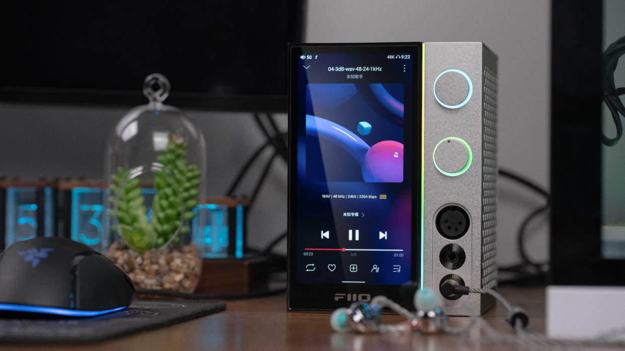  FiiO R9 Desktop Player on a desk near headphones and a mouse. 