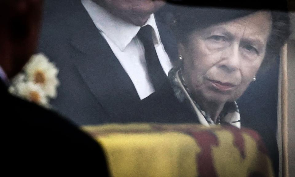 Princess Anne looks toward the coffin of the late Queen Elizabeth II, draped with the Royal Standard of Scotland, after arriving at the palace of Holyroodhouse in Edinburgh.