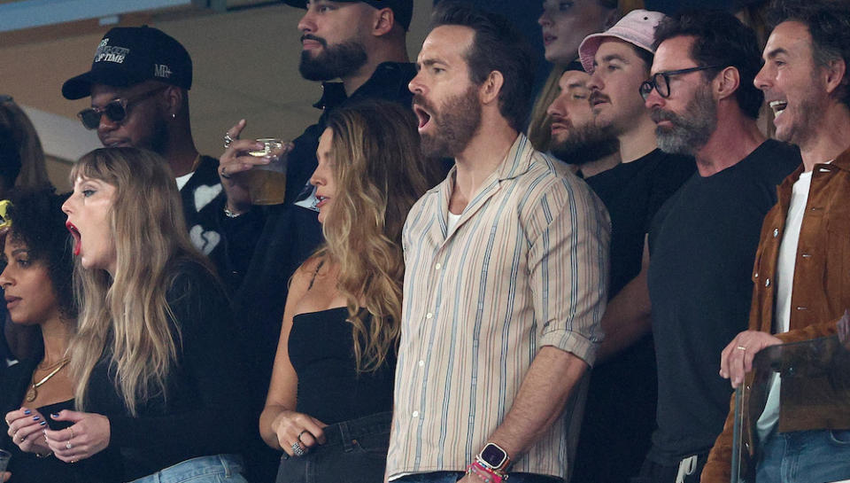 EAST RUTHERFORD, NEW JERSEY - OCTOBER 01: (L-R) Singer Taylor Swift, Actor Ryan Reynolds and Actor Hugh Jackman cheer prior to the game between the Kansas City Chiefs and the New York Jets at MetLife Stadium on October 01, 2023 in East Rutherford, New Jersey. (Photo by Elsa/Getty Images)