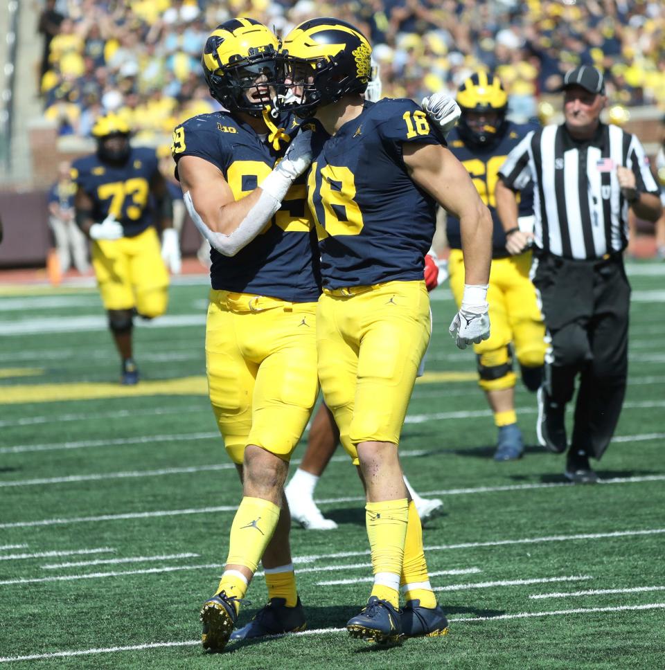 Michigan tight ends AJ Barner, left, and Colston Loveland celebrate after a catch during the second half of Michigan's 31-7 win on Saturday, Sept. 23 2023, in Ann Arbor.