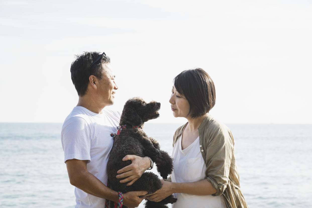 A couple with a pet dog.