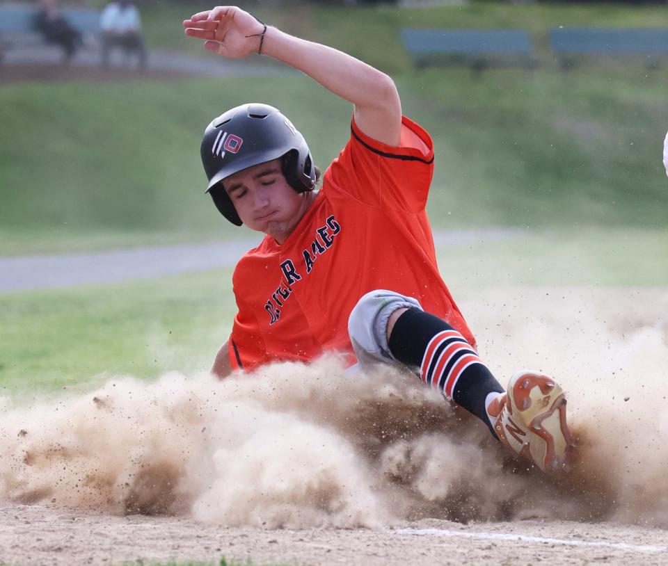 John Muir, of Oliver Ames, scores a run during a game versus Stoughton on Monday, May 16, 2022.