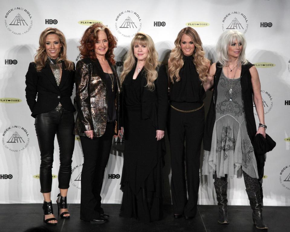 From left, Sheryl Crow, Bonnie Raitt, Stevie Nicks, Carrie Underwood, and Emmylou Harris appear in the press room at the 2014 Rock and Roll Hall of Fame Induction Ceremony on Thursday, April, 10, 2014, in New York. (Photo by Andy Kropa/Invision/AP)