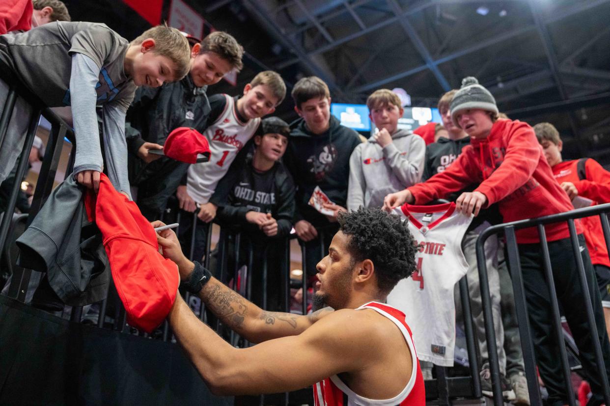 Dec 21, 2023; Columbus, OH, USA;
Ohio State Buckeyes guard Roddy Gayle Jr. (1) signs fans gear after their 78-36 win against the New Orleans Privateers on Thursday, Dec. 21, 2023 at Value City Arena.