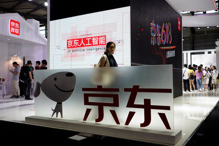 A sign of China's e-commerce company JD.com is seen at CES (Consumer Electronics Show) Asia 2018 in Shanghai, China June 14, 2018. REUTERS/Aly Song/File Photo