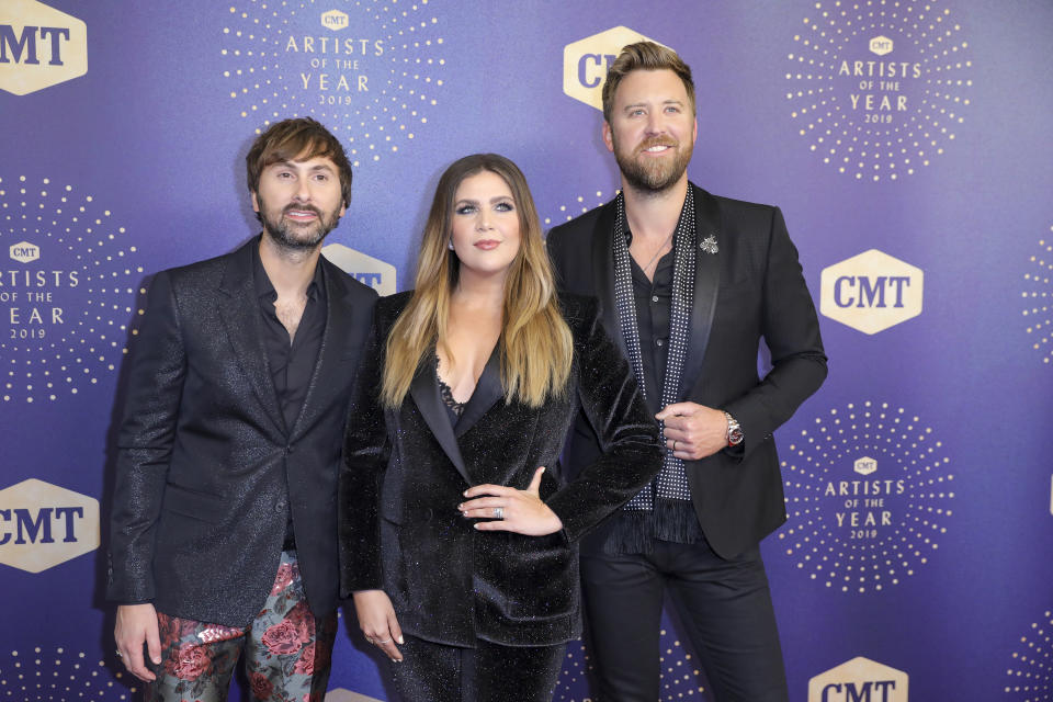 FILE - This Oct. 16, 2019 file photo shows Dave Haywood, from left, Hillary Scott, and Charles Kelley of Lady Antebellum at 2019 CMT Artists of the Year in Nashville, Tenn. The group is changing their name to Lady A, saying they are regretful for not taking into consideration the word's associations with slavery. They said in recent weeks, their eyes have been opened to “blindspots we didn’t even know existed” and “the injustices, inequality and biases black women and men have always faced.” (Photo by Al Wagner/Invision/AP, FIle)