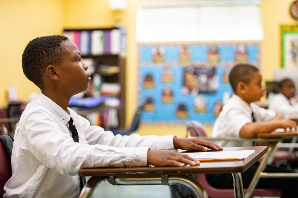 Boys attending Bethel Christian Academy do their school work during class on Monday, Aug. 28, 2023.