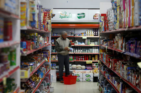 A Palestinian man shops at a supermarket in Gaza City January 15, 2018. REUTERS/Mohammed Salem