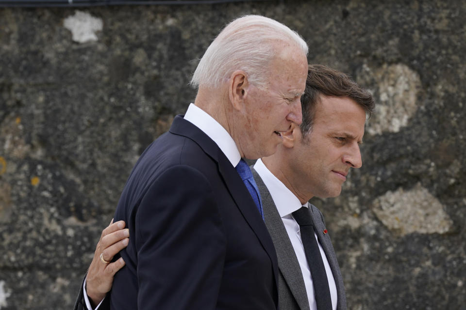 President Joe Biden speaks with French President Emmanuel Macron after posing for the G-7 family photo with guests at the G-7 summit, Friday, June 11, 2021, in Carbis Bay, England. (AP Photo/Patrick Semansky, Pool)