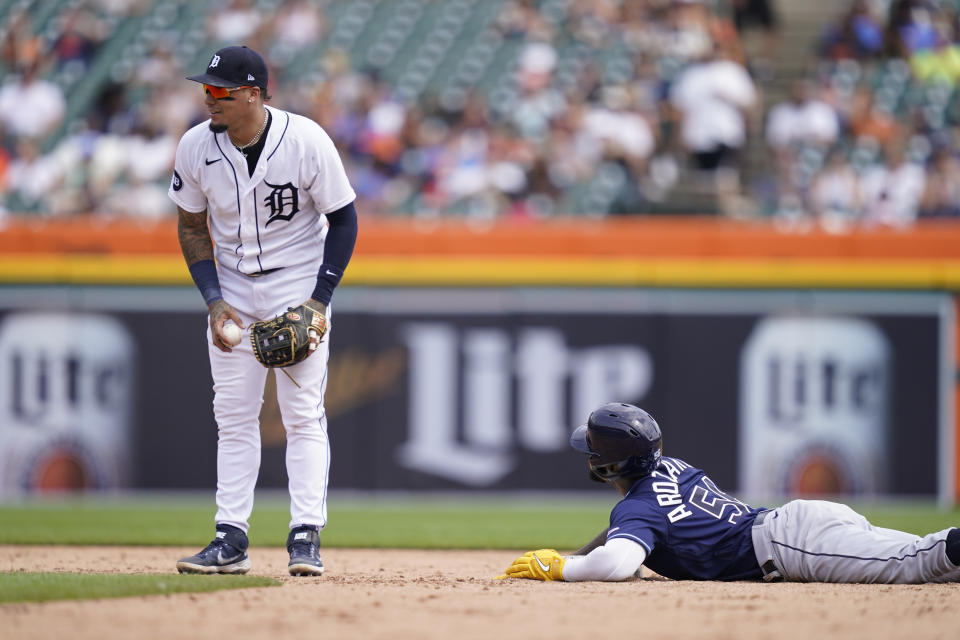 Tampa Bay Rays' Randy Arozarena looks to Detroit Tigers shortstop Javier Baez after being tagged out during an attempted steal in the sixth inning of a baseball game, Sunday, Aug. 7, 2022, in Detroit. (AP Photo/Carlos Osorio)