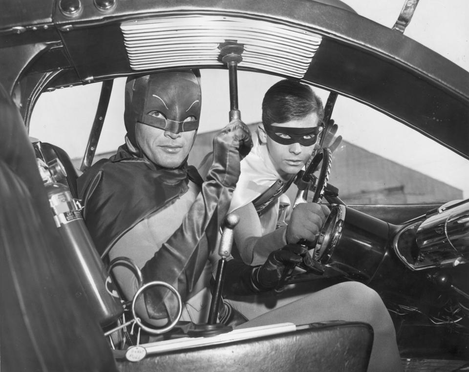 Adam West and Burt Ward as Batman and Robin in the Batmobile, 1966