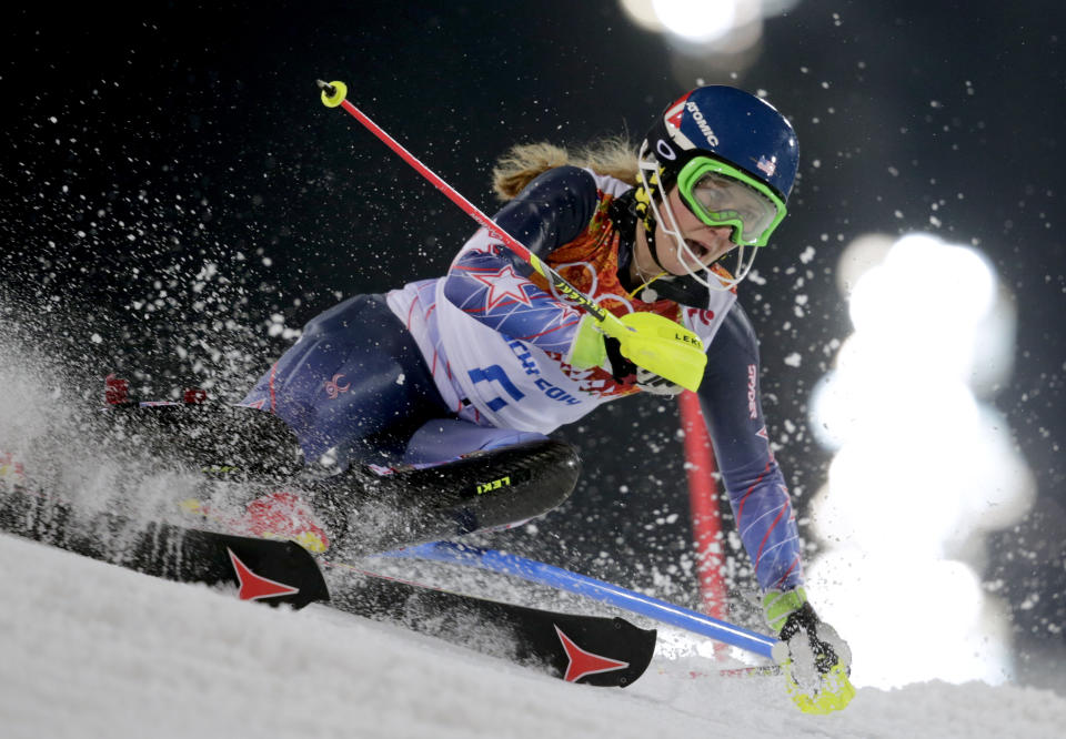 Gold medal winner Mikaela Shiffrin skis past a gate in the women's slalom at the Sochi 2014 Winter Olympics, Friday, Feb. 21, 2014, in Krasnaya Polyana, Russia. (AP Photo/Charles Krupa)