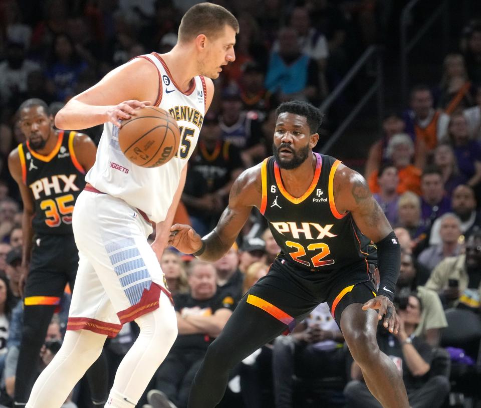 Phoenix Suns center Deandre Ayton (22) guard Denver Nuggets center Nikola Jokic (15) during Game 3 of the Western Conference Semifinals at the Footprint Center in Phoenix on May 5, 2023 in Phoenix on May 5, 2023.