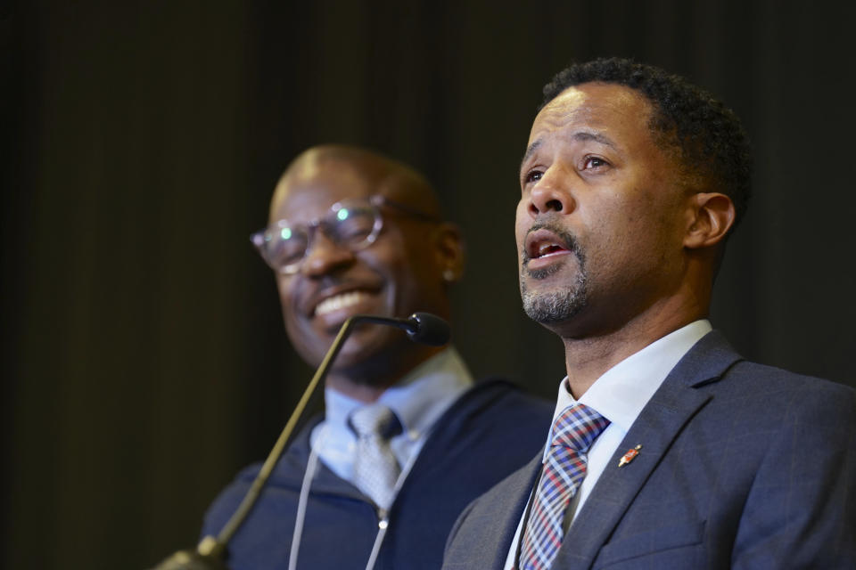 Bishop Cedrick Bridgeforth addresses the delegates, guests and his new episcopal colleagues, shortly after his election on Nov. 4, 2022, at Christ United Methodist Church in Salt Lake City. At left is his husband, Christopher Hucks-Ortiz. Bridgeforth is the first openly gay African-American man to be elected bishop. The vote comes six years after the Western Jurisdiction elected the denomination's first openly lesbian bishop, Karen Oliveto of the Mountain Sky Episcopal Area. (Patrick Scriven/United Methodist News via AP)