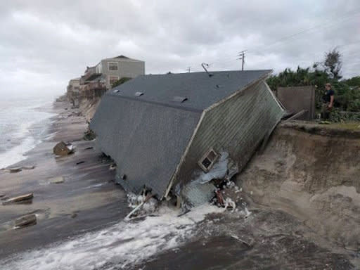 A firefighter views a collapsed coastal house after Hurricane Irma passed the area in Vilano Beach, Florida, on Sept.&nbsp;11, 2017.