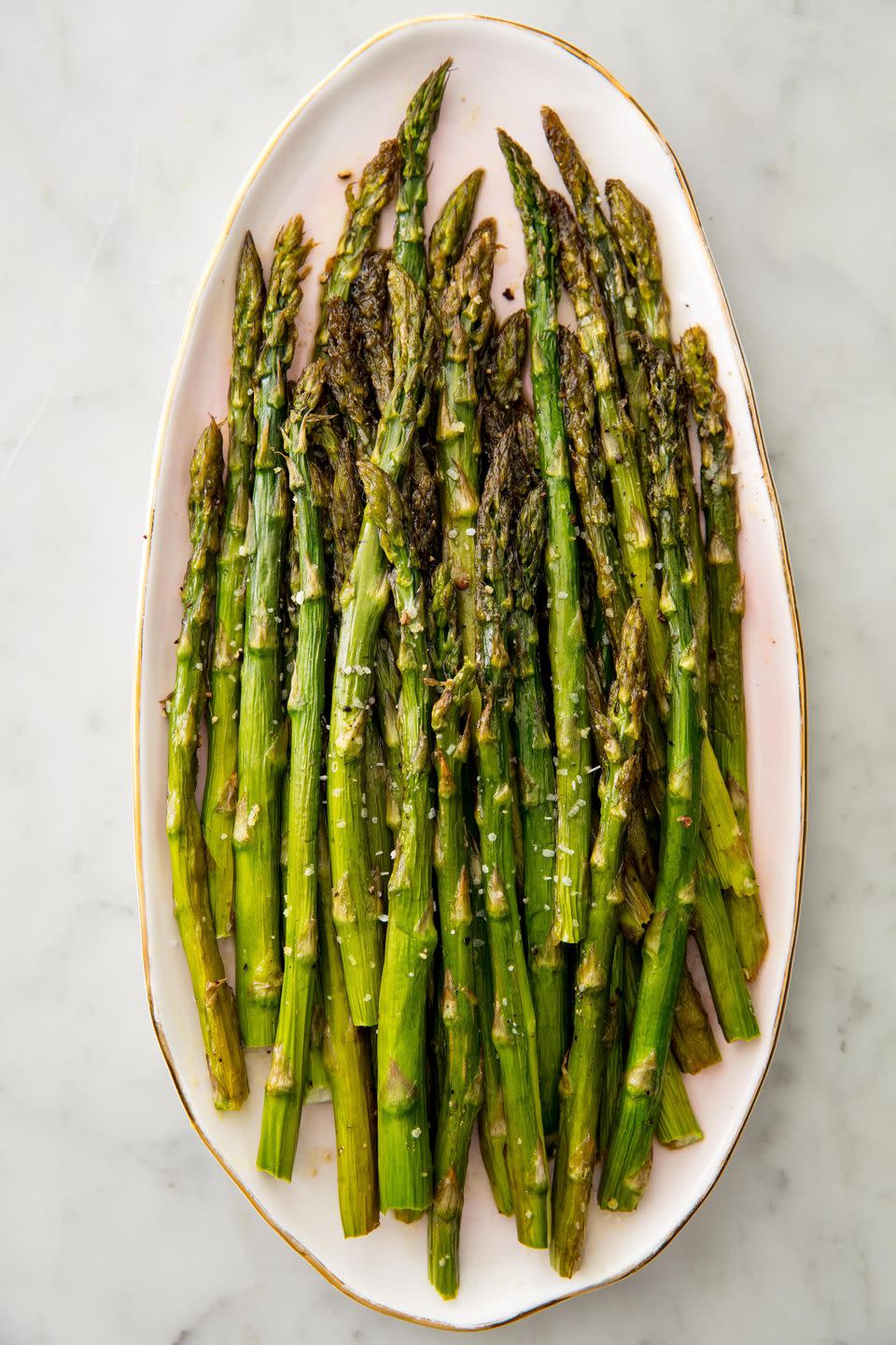 <p>Here's how to roast perfect asparagus every time.</p><p>Get the <strong><a href="https://www.delish.com/cooking/recipe-ideas/recipes/a58375/oven-roasted-asparagus-recipe/" rel="nofollow noopener" target="_blank" data-ylk="slk:Roasted Asparagus recipe;elm:context_link;itc:0" class="link ">Roasted Asparagus recipe</a></strong>.</p>