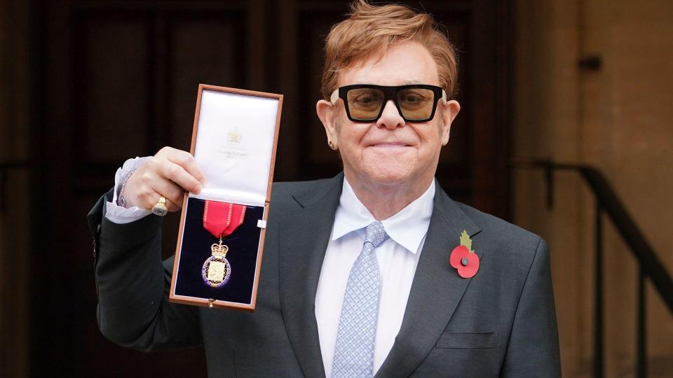 Sir Elton John with the insignia of the Order of the Companions of Honour 