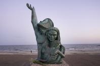 The 1900 Great Storm Statue sits on the sea wall in Galveston, Texas, Monday, Sept. 18, 2023. (AP Photo/LM Otero)