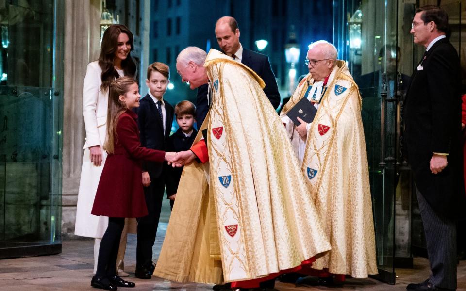 Princess Charlotte greets Rev David Stanton and the Dean of Westminster Rev Dr David Hoyle