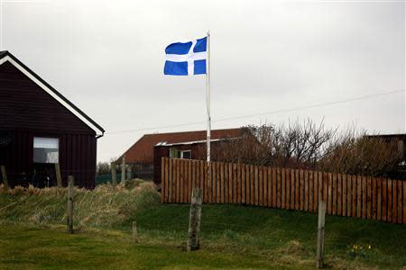 The flag of Shetland flies in a garden on the Shetland Islands April 3, 2014. REUTERS/Cathal McNaughton