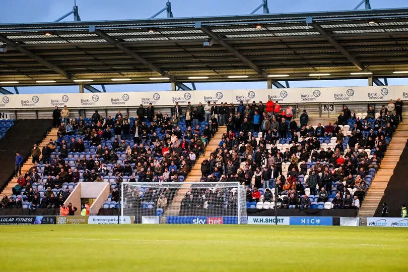 Grimsby fans during the Sky Bet League Two match between Colchester United FC and Grimsby Town FC at the JobServe Community Stadium, Colchester, England on the 16th April 2024.