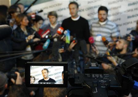 An image of opposition leader Alexei Navalny is seen on a camera display screen as he speaks to the media at his campaign headquarters after voting closed in a mayoral election in Moscow September 8, 2013. REUTERS/Maxim Shemetov