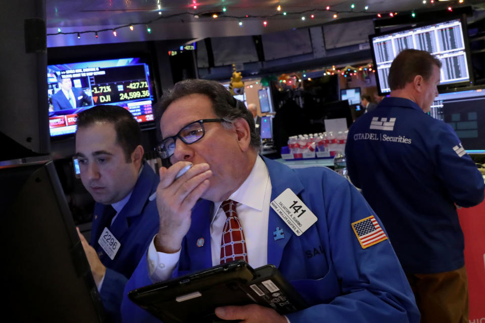 Traders work on the floor of the New York Stock Exchange (NYSE) in New York, U.S., December 6, 2018. REUTERS/Brendan McDermid