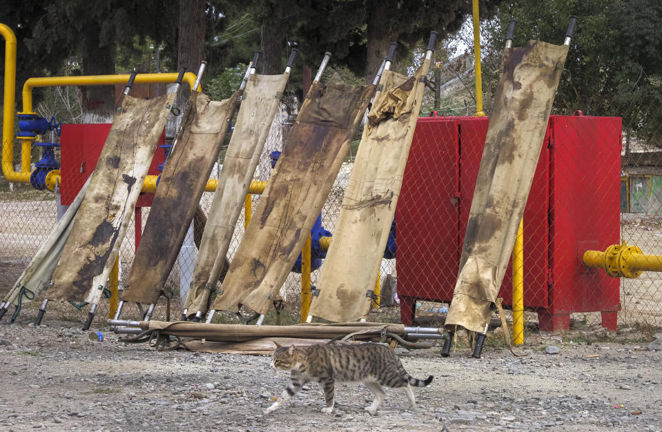 Blood stained stretchers are dried in the yard of a military hospital near the frontline in the separatist region of Nagorno-Karabakh, Monday, Oct. 26, 2020. Armenia and Azerbaijan have accused each other of violating the new U.S.-brokered cease-fire aimed to halt the fighting over the separatist region of Nagorno-Karabakh. (AP Photo)