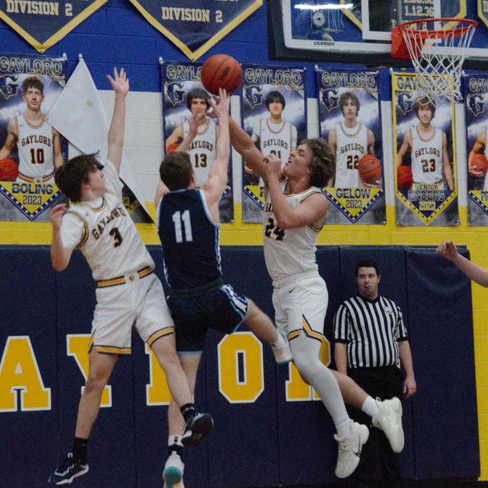 Brady Pretzlaff (24) blocks a shot during a high school basketball matchup between Gaylord and Petoskey on Friday, February 4 in Gaylord, Mich.