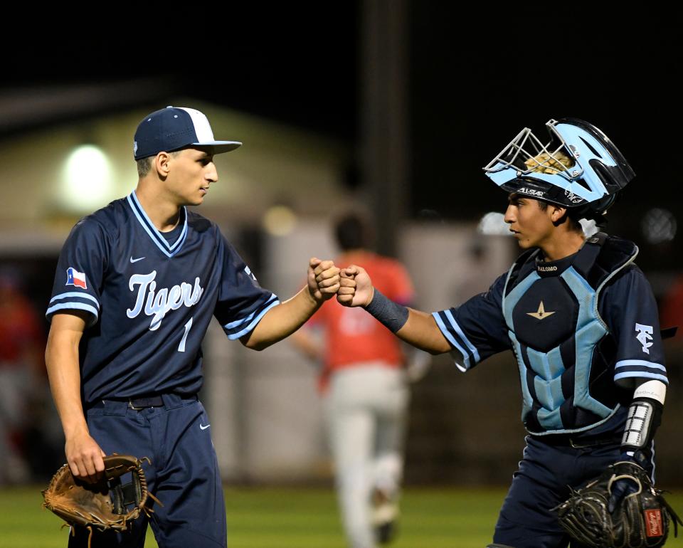 Carroll pitcher Dylan Dudney and catcher Dae Palomo fist bump against Gregory-Portland in the Class 5A regional quarterfinal playoff game, Wednesday, May 19, 2021, Cabaniss Baseball Field. Gregory-Portland won, 1-0.
